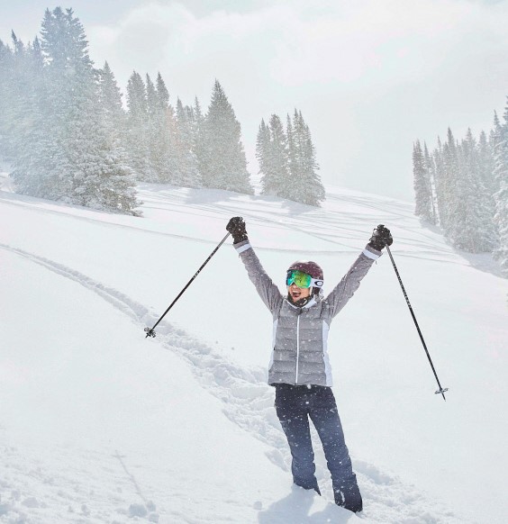 Happy woman skiing vail