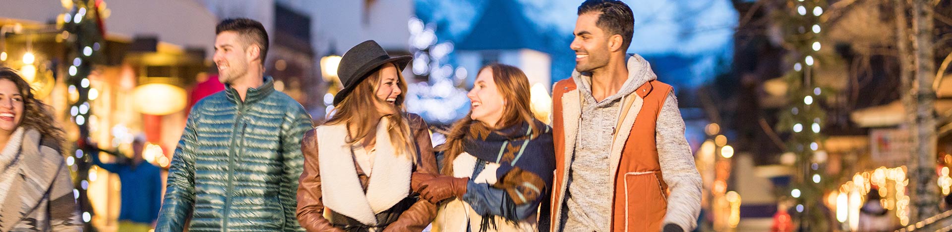 Group of young people having fun in Vail Village 1920x469